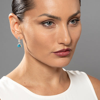 Swiss Blue Topaz And Lab Grown Diamond Cable Dangle Halo Earrings In 14 Karat White Gold Trillion Cut 4 38 Carats Total Friction Backs E19216 on a model