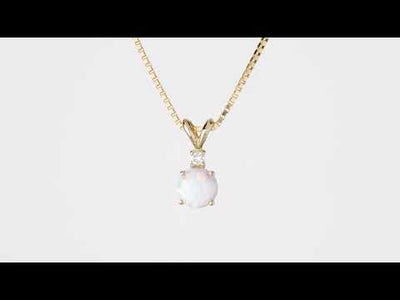 Video of Peora 14 Karat Yellow Gold Created Opal Diamond Solitaire Pendant P9856. Includes a Peora gift box. Free shipping, 30-day returns, authenticity guaranteed. 