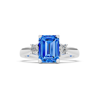 Swiss Blue Topaz Three Stone Emerald Cut Engagement Ring With Accent