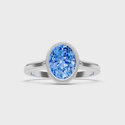 Swiss Blue Topaz Oval Shape Bezel Set Solitaire Ring