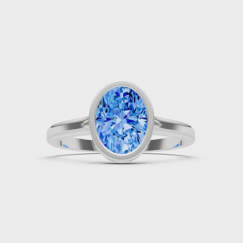 Swiss Blue Topaz Oval Shape Bezel Set Solitaire Ring