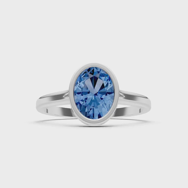 London Blue Topaz Oval Shape Bezel Set Solitaire Ring