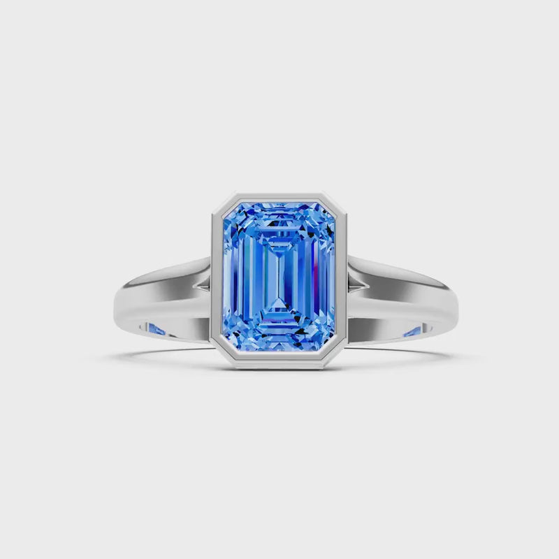 Swiss Blue Topaz Emerald Cut Bezel Set Solitaire Ring