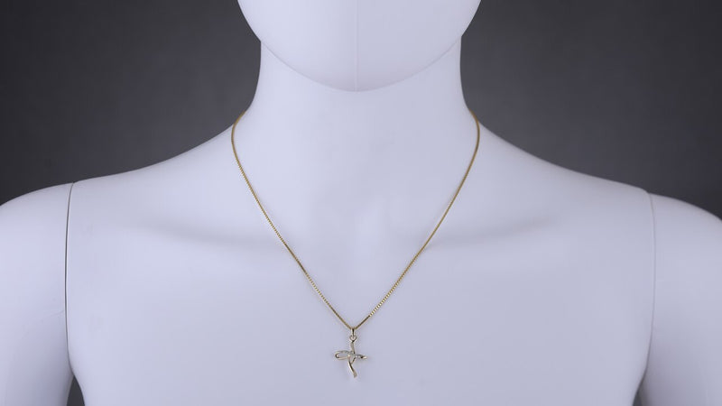 14K Yellow Gold Diamond Accent Abstract Cross Pendant P10094 on a model