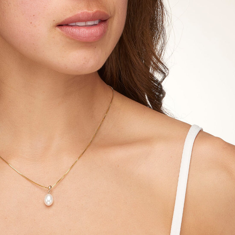 Freshwater Cultured White Pearl Pendant In 14K Yellow Gold Baroque Oval Shape 10X8Mm Dainty Solitaire P10190 on a model