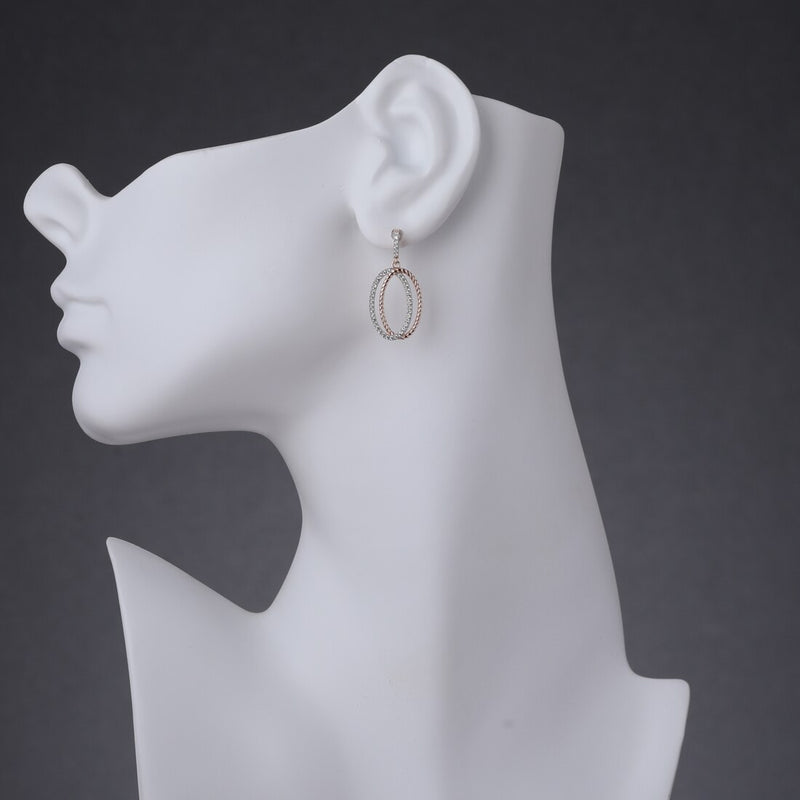 Sterling Silver Simulated Diamonds Twisted Oval Rose Tone Dangle Drop Earrings Se9082 on a model