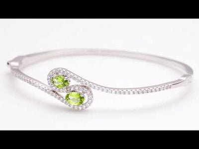 Video of Peridot Infinity Bangle Bracelet Sterling Silver Oval Shape 1 Carats SB4396. Includes a Peora gift box. Free shipping, 30-day returns, authenticity guaranteed. 