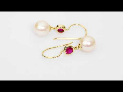 Video of 8mm Freshwater Cultured White Pearl and Created Ruby Fish Hook Earrings in 14K Yellow Gold. Includes a Peora gift box. Free shipping, 45-day returns, authenticity guaranteed. E19364