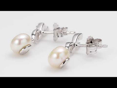 Video of Freshwater Pearl Earrings Sterling Silver Round Button 6.5mm SE8346. Includes a Peora gift box. Free shipping, 30-day returns, authenticity guaranteed. 