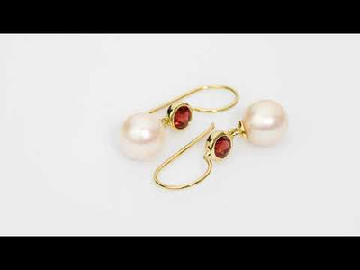 Video of 8mm Freshwater Cultured White Pearl and Garnet Fish Hook Earrings in 14K Yellow Gold.  Includes a Peora gift box. Free shipping, 45-day returns, authenticity guaranteed. E19352