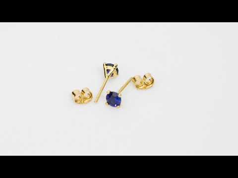 Video of 4mm Round Created Blue Sapphire Solitaire Stud Earrings in 14K Yellow Gold.  Includes a Peora gift box. Free shipping, 45-day returns, authenticity guaranteed. E19344