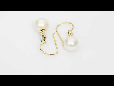 Video of 8mm Freshwater Cultured White Pearl and Swiss Blue Topaz Fish Hook Earrings in 14K Yellow Gold.  E19374