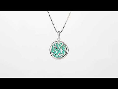 Video of Created Teal Fire Opal Pendant Necklace in Sterling Silver, 3 Carats. Includes a Peora gift box. Free shipping, 45-day returns, authenticity guaranteed. SP12530