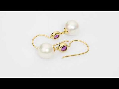 Video of 8mm Freshwater Cultured White Pearl and Amethyst Fish Hook Earrings in 14K Yellow Gold.  Includes a Peora gift box. Free shipping, 45-day returns, authenticity guaranteed. E19354