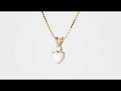 Video of Peora 14 Karat Yellow Gold Heart Shape Created Opal Diamond Pendant P9868. Includes a Peora gift box. Free shipping, 30-day returns, authenticity guaranteed. 