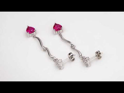 Video of Ruby Earrings Sterling Silver Heart Shape 2 Carats SE7340. Includes a Peora gift box. Free shipping, 30-day returns, authenticity guaranteed. 