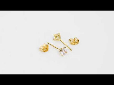 Video of  4mm Round Cubic Zirconia Solitaire Stud Earrings in 14K Yellow Gold. Includes a Peora gift box. Free shipping, 45-day returns, authenticity guaranteed. E19334