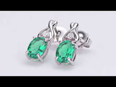 Video of Simulated Emerald Earrings Sterling Silver Oval Shape 2 Carats SE8228. Includes a Peora gift box. Free shipping, 30-day returns, authenticity guaranteed. 