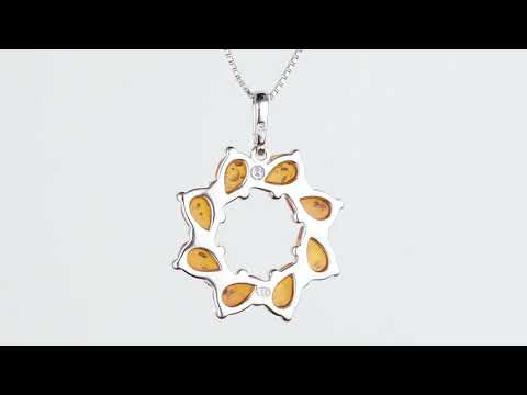 Video of Genuine Baltic Amber Open Wreath Pendant Necklace In Sterling Silver SP12028. Includes a Peora gift box. Free shipping, 30-day returns, authenticity guaranteed. 